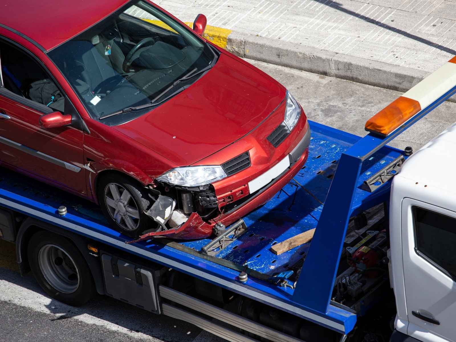 damaged car flatbed accident tow