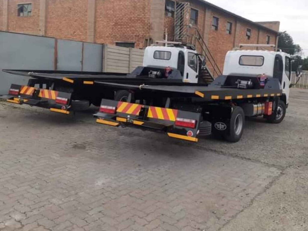 machinery towing flatbed trucks